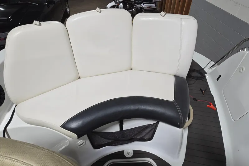 Slide: The Image of 2007 Sea-Doo Islandia SE boat seating with white and black upholstery. - 19