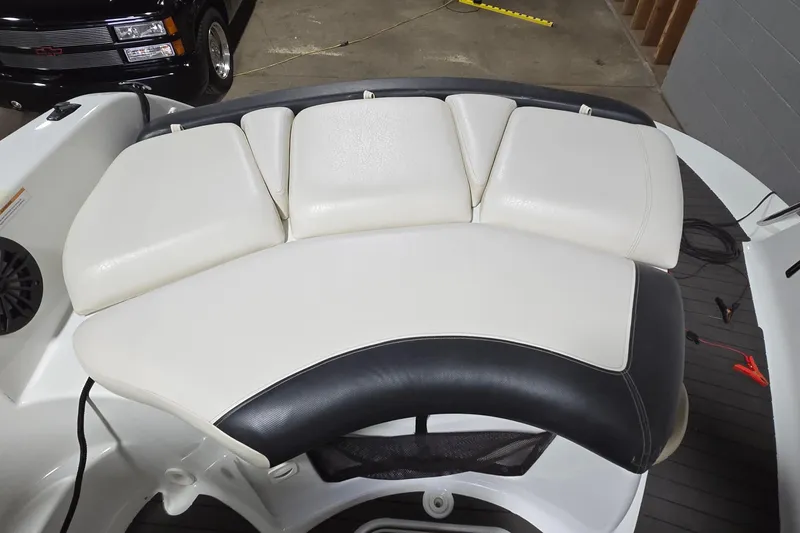 Slide: The Image of 2007 Sea-Doo Islandia SE boat interior with white and black cushioned seating. - 20