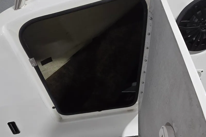 Slide: The Image of 2007 Sea-Doo Islandia SE boat storage compartment with open hatch. - 22