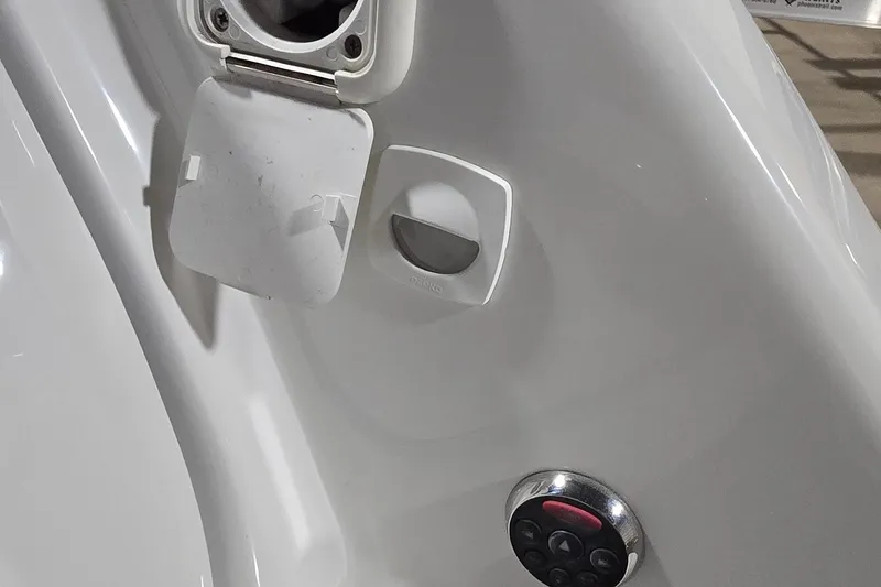 Slide: The Image of 2007 Sea-Doo Islandia SE boat control panel with buttons and cover. - 23