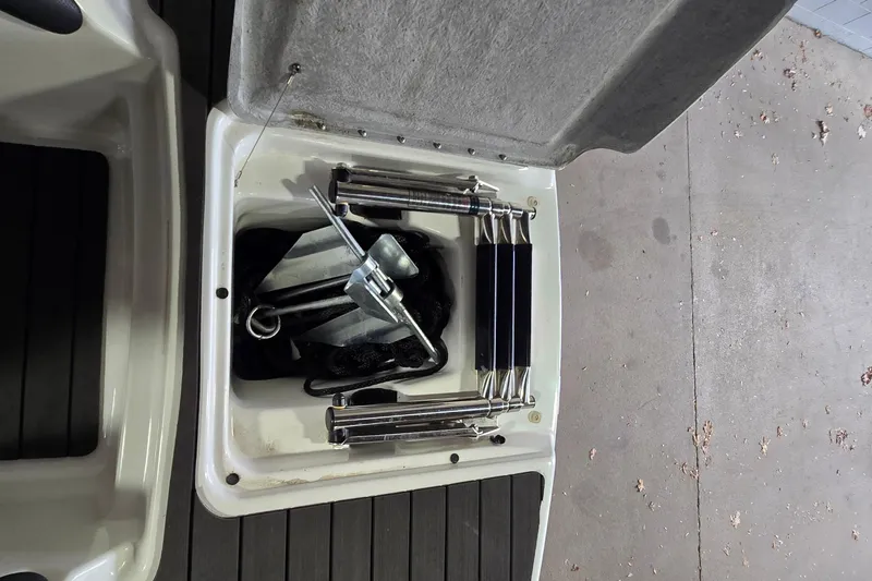 Slide: The Image of 2007 Sea-Doo Islandia SE storage compartment with anchor and ladder. - 24
