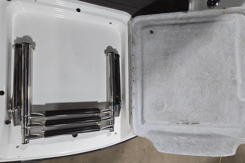 Slide: The Image of 2007 Sea-Doo Islandia SE boat ladder compartment with stainless steel folding ladder. - 25