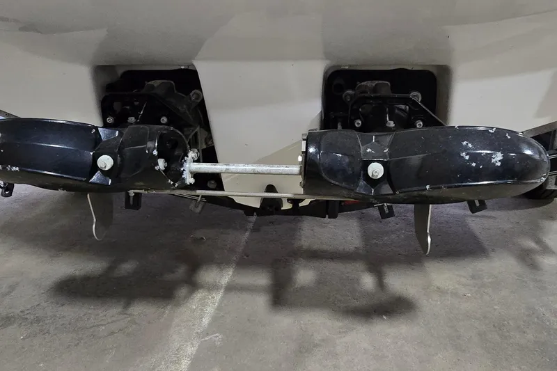 Slide: The Image of Rear view of a 2007 Sea-Doo Islandia SE boat's propulsion system in a garage. - 27