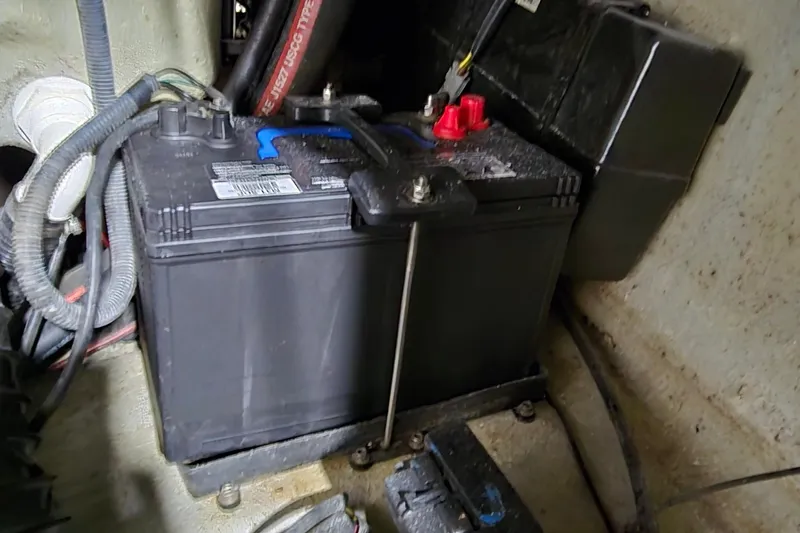 Slide: The Image of Battery compartment of a 2007 Sea-Doo Islandia SE boat, showing wiring and connections. - 31