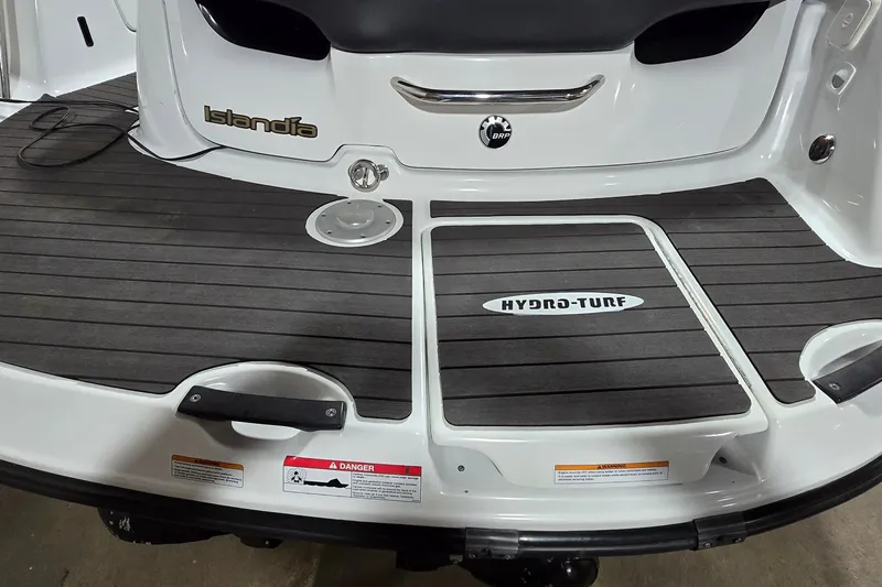 Slide: The Image of 2007 Sea-Doo Islandia SE boat deck with Hydro-Turf matting and safety warnings. - 7