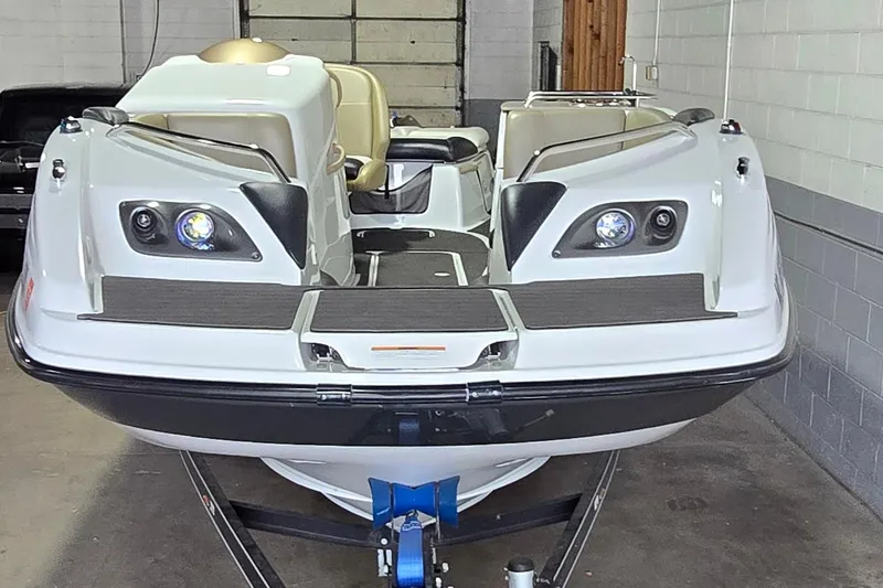 Slide: The Image of 2007 Sea-Doo Islandia SE boat in a garage, front view, on a trailer. - 9