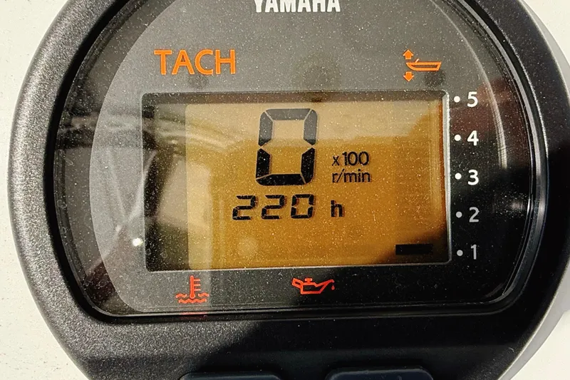 Slide: The Image of 2015 Sportsman Heritage 231 Center Console boat interior with seating and Yamaha 250 engine. - 13