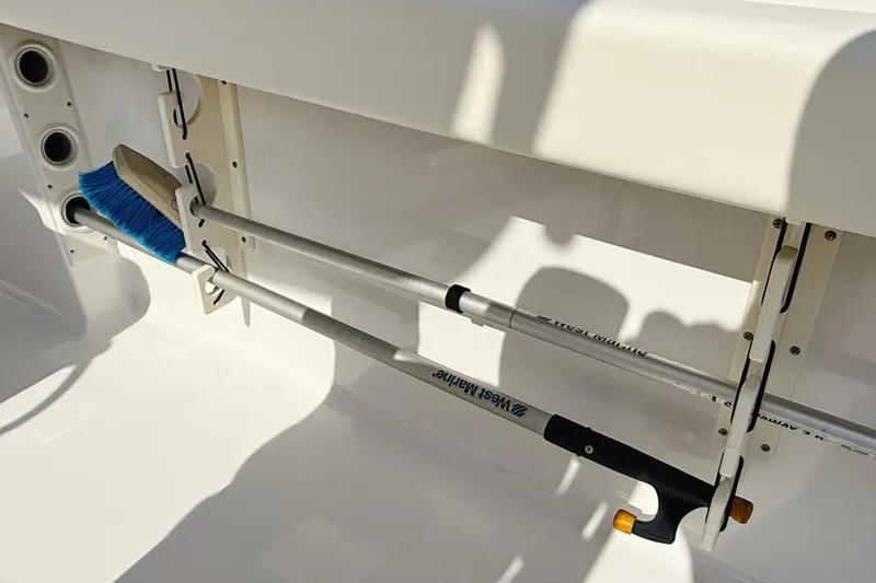 Slide: The Image of 2015 Sportsman Heritage 231 Center Console boat interior with steering wheel and controls. - 14