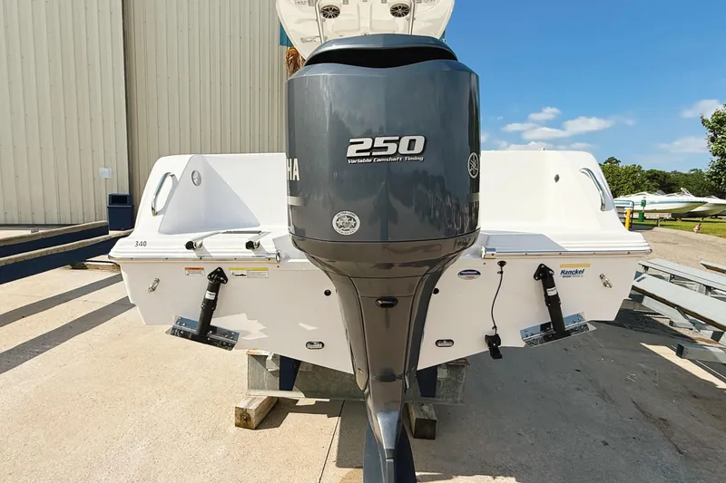 Slide: The Image of 2015 Sportsman Heritage 231 Center Console with Yamaha 250 engine, docked outdoors. - 26