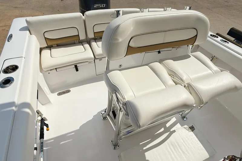 Slide: The Image of 2015 Sportsman Heritage 231 Center Console boat on display outdoors. - 7