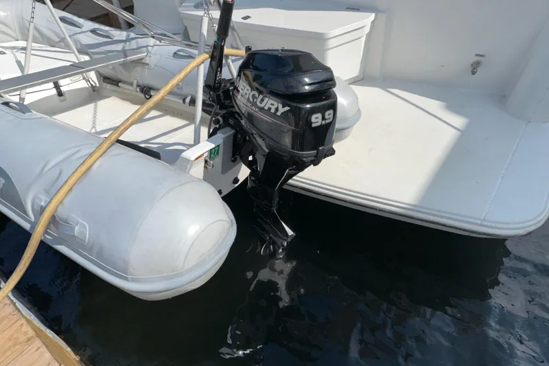 Slide: The Image of 1998 Carver 445 Aft Cabin Motor Yacht docked at a marina under cloudy skies. - 11