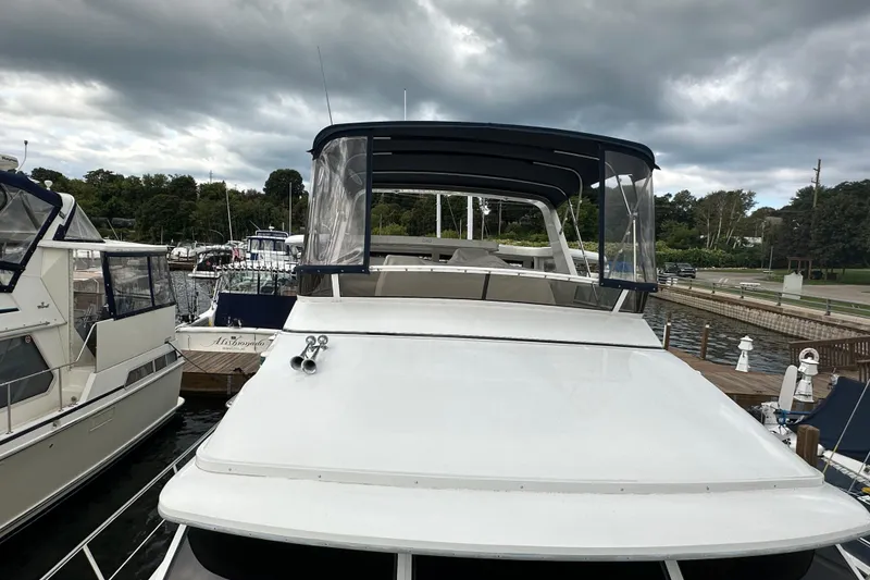 Slide: The Image of Inflatable boat with Mercury motor docked beside 1998 Carver 445 Aft Cabin Motor Yacht. - 20