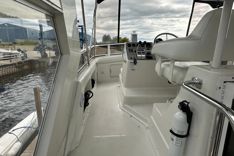 Slide: The Image of Bow view of 1998 Carver 445 Aft Cabin Motor Yacht at dock. - 24