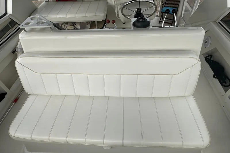 Slide: The Image of 1998 Carver 445 Aft Cabin Motor Yacht docked at marina, view from bow. - 27