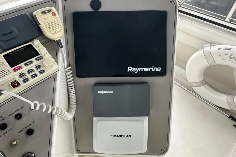 Slide: The Image of 1998 Carver 445 Aft Cabin Motor Yacht docked at marina, side view. - 32