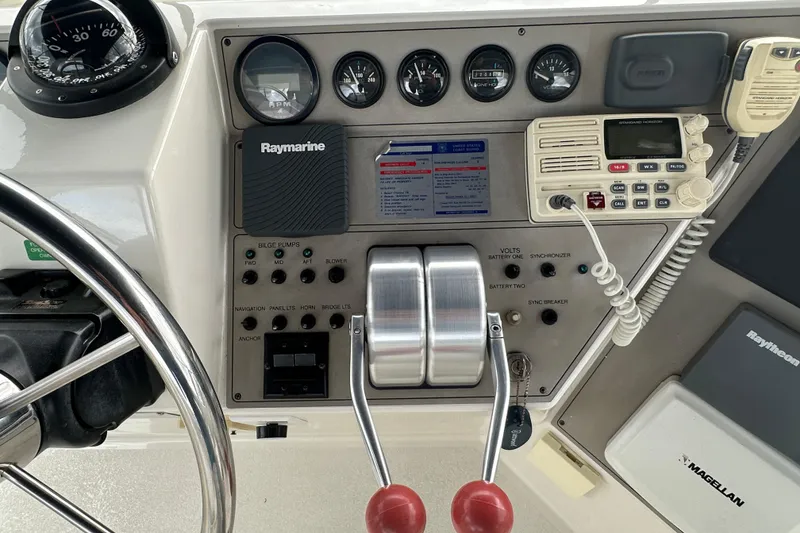 Slide: The Image of 1998 Carver 445 Aft Cabin Motor Yacht docked at marina, view from helm. - 35