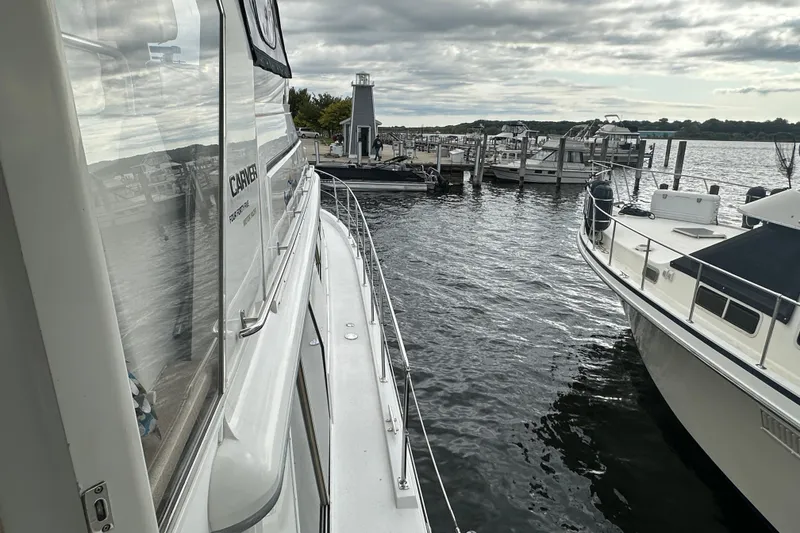 Slide: The Image of Control panel of a 1998 Carver 445 Aft Cabin Motor Yacht with gauges and controls. - 42