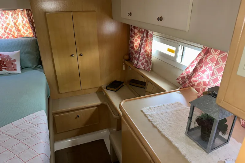 Slide: The Image of 1998 Carver 445 Aft Cabin Motor Yacht docked, showing stairs and deck area. - 51