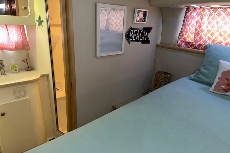 Slide: The Image of 1998 Carver 445 Aft Cabin Motor Yacht interior with seating and table on deck. - 54