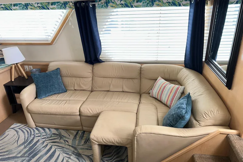 Slide: The Image of 1998 Carver 445 Aft Cabin Motor Yacht bedroom with cozy bed and wooden cabinetry. - 60