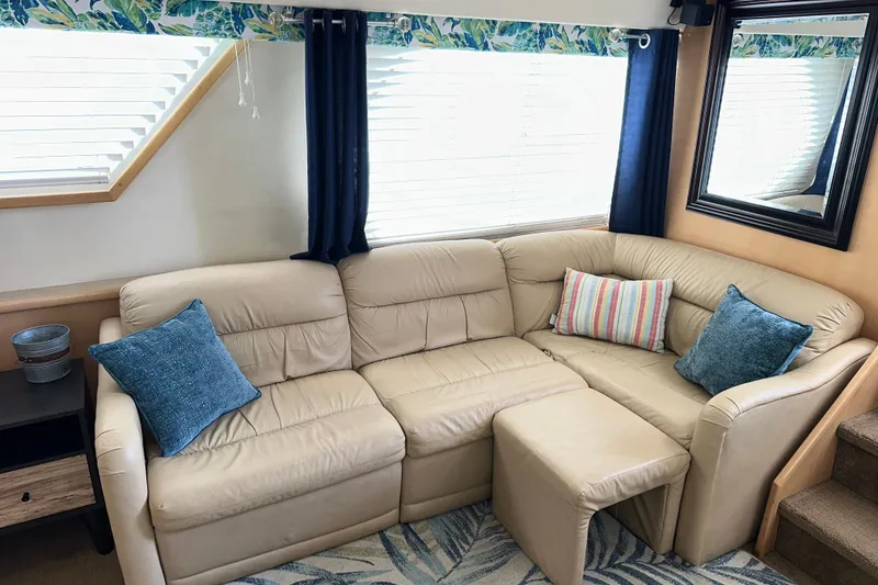 Slide: The Image of Interior of 1998 Carver 445 Aft Cabin Motor Yacht with cozy bedroom and decorative elements. - 62