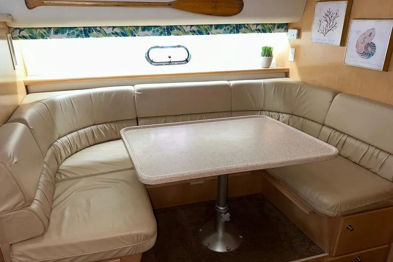 Slide: The Image of Interior of 1998 Carver 445 Aft Cabin Motor Yacht with cozy seating and TV. - 70