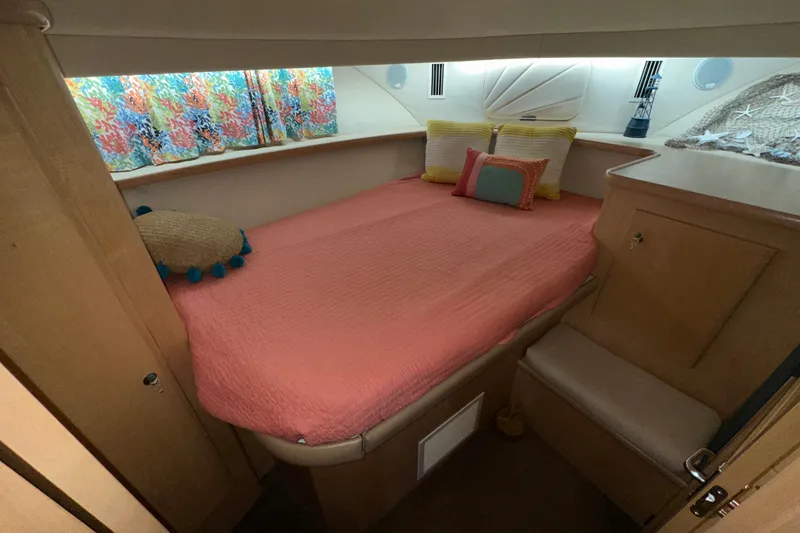 Slide: The Image of Interior of 1998 Carver 445 Aft Cabin Motor Yacht with cozy seating and modern decor. - 76