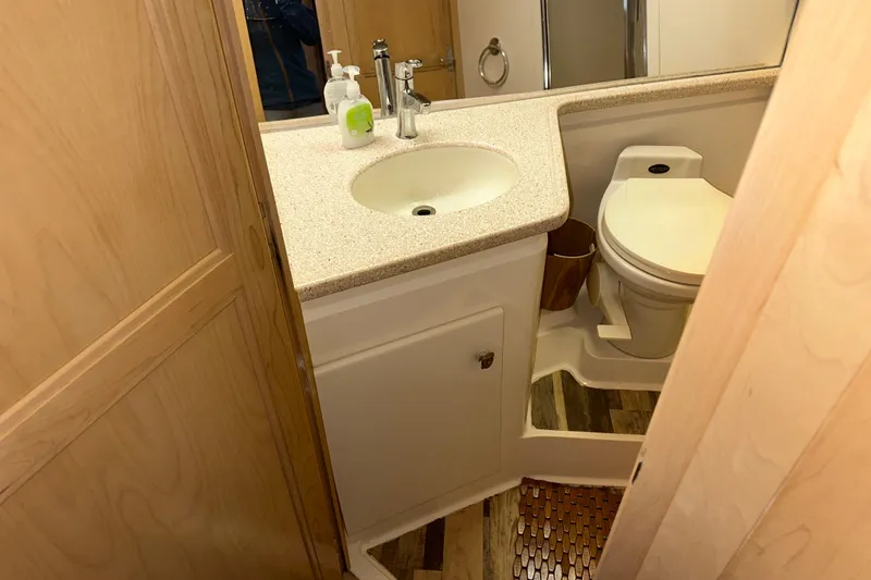 Slide: The Image of Interior of 1998 Carver 445 Aft Cabin Motor Yacht with dining area and kitchenette. - 77