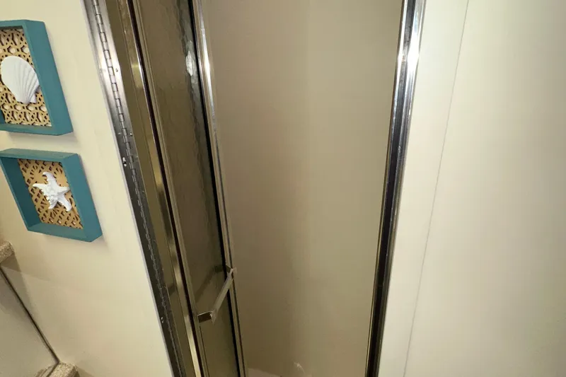 Slide: The Image of 1998 Carver 445 Aft Cabin Motor Yacht interior with kitchen and dining area. - 79