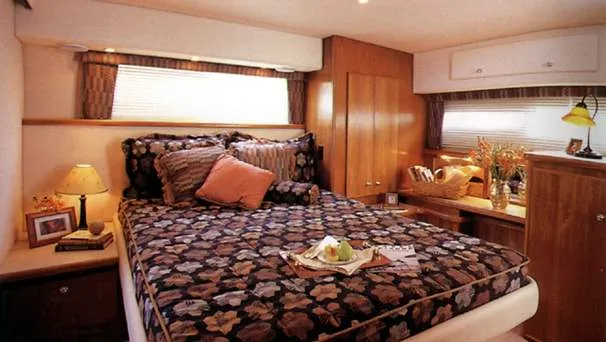 Slide: The Image of Engine room of 1998 Carver 445 Aft Cabin Motor Yacht with visible machinery and wiring. - 97