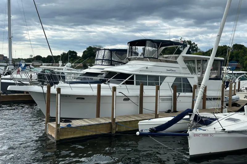 The Image of 1998 Carver 445 Aft Cabin Motor Yacht on trailer, ready for launch. - 0