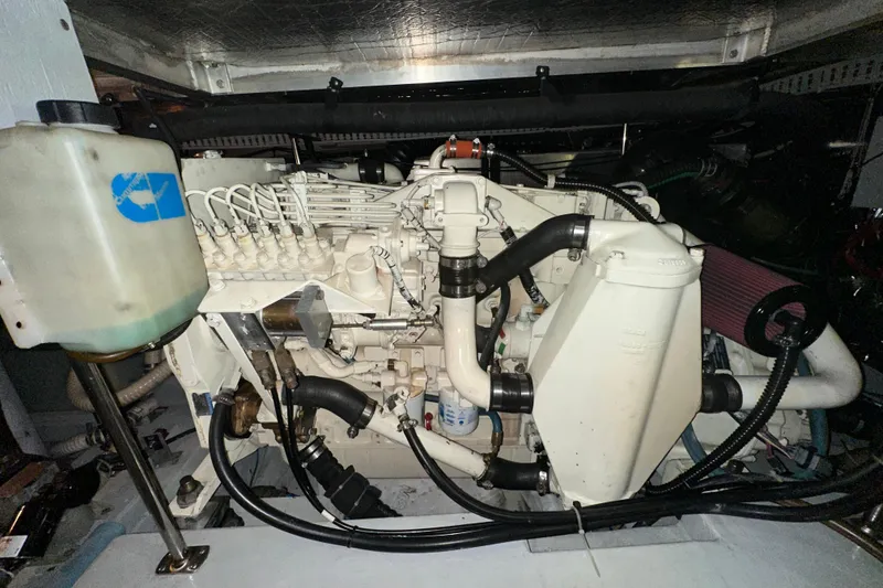 Slide: The Image of Engine room of 1998 Carver 445 Aft Cabin Motor Yacht, showcasing mechanical components. - 101
