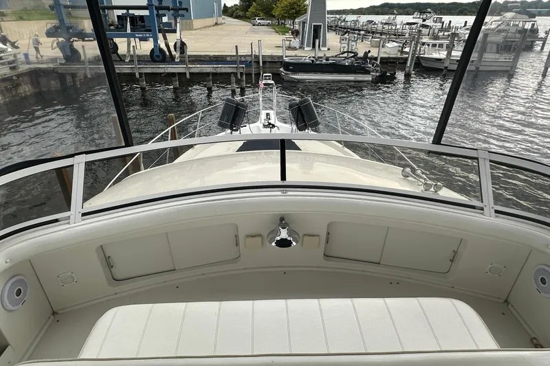 Slide: The Image of 1998 Carver 445 Aft Cabin Motor Yacht docked at marina with overcast sky. - 25