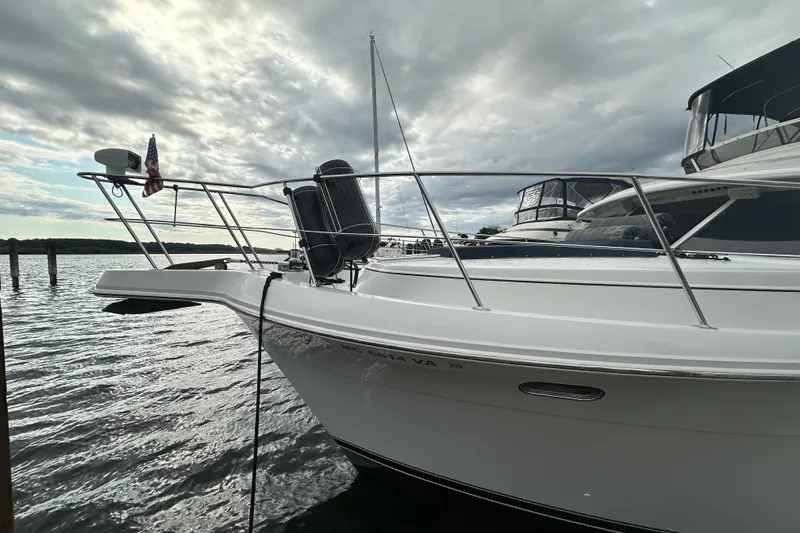 Slide: The Image of 1998 Carver 445 Aft Cabin Motor Yacht on red trailer at marina. - 3