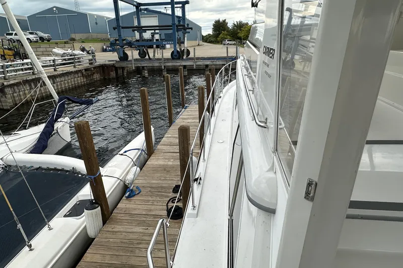 Slide: The Image of 1998 Carver 445 Aft Cabin Motor Yacht helm with gauges and controls. - 41