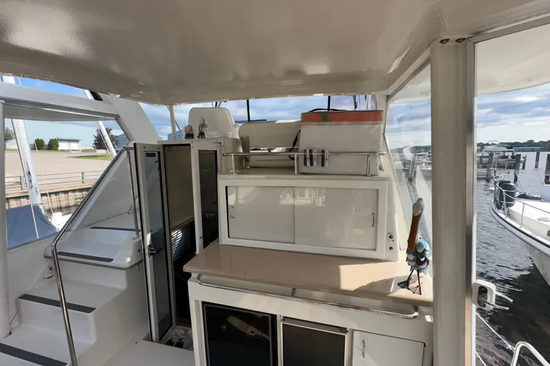 Slide: The Image of Control panel of 1998 Carver 445 Aft Cabin Motor Yacht with Raymarine display. - 45