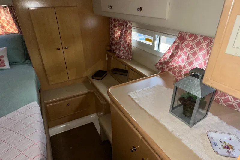 Slide: The Image of 1998 Carver 445 Aft Cabin Motor Yacht interior with dock view. - 50