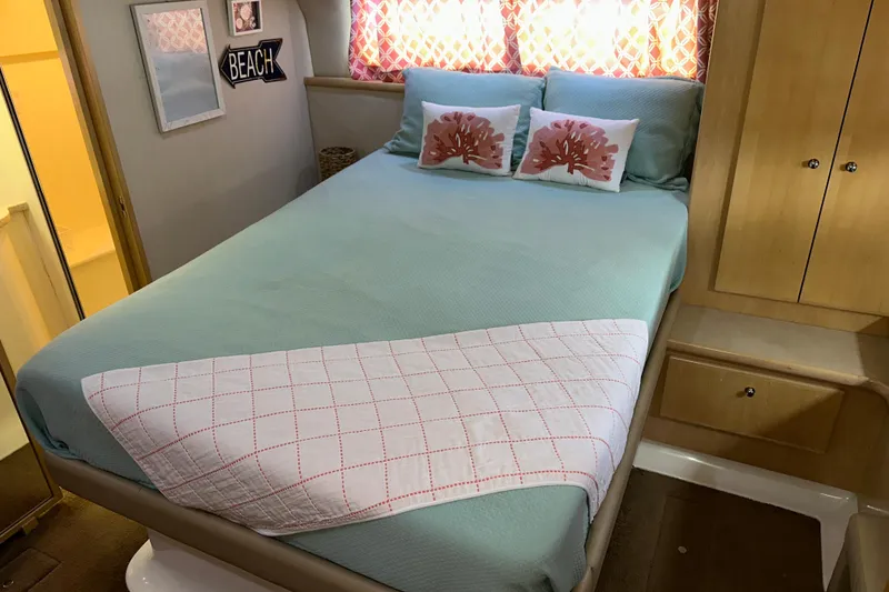 Slide: The Image of 1998 Carver 445 Aft Cabin Motor Yacht docked at marina with wooden pier. - 52