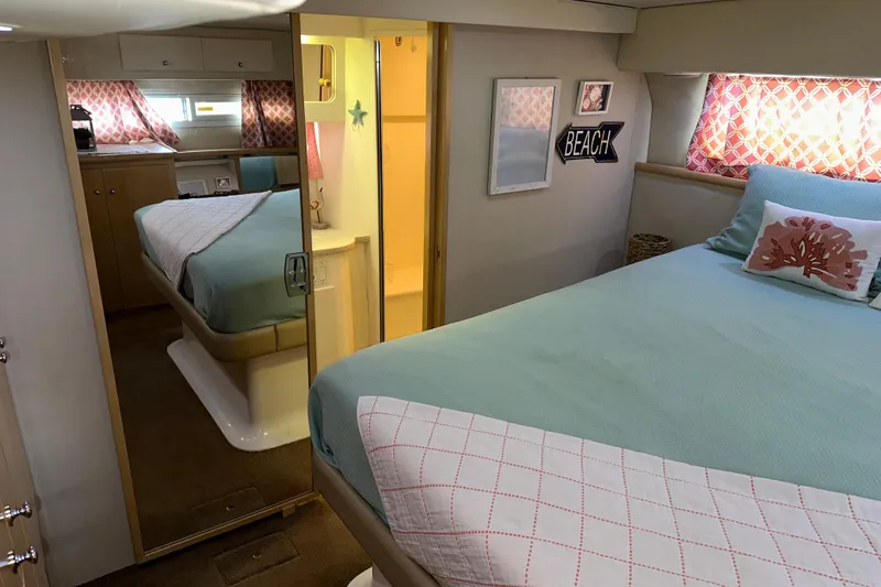 Slide: The Image of 1998 Carver 445 Aft Cabin Motor Yacht docked at marina under cloudy sky. - 53