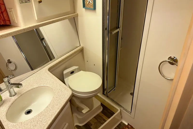 Slide: The Image of Interior of 1998 Carver 445 Aft Cabin Motor Yacht with modern kitchen amenities. - 78