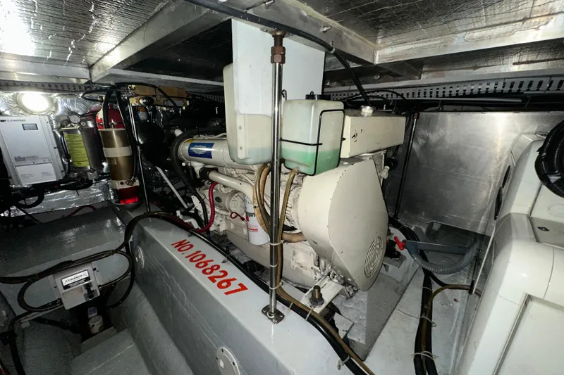 Slide: The Image of 1998 Carver 445 Aft Cabin Motor Yacht kitchen with wooden cabinets and built-in coffee maker. - 85