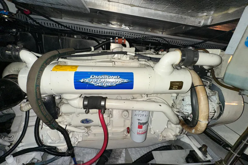 Slide: The Image of 1998 Carver 445 Aft Cabin Motor Yacht bathroom with sink, toilet, and shower. - 89