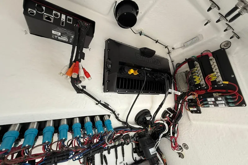Slide: The Image of Electrical system setup in a 2025 Cape Horn 22 OS boat, featuring wiring and components. - 17