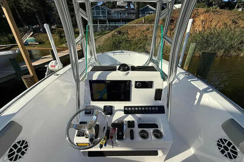 Slide: The Image of 2025 Cape Horn 22 OS boat cockpit with steering wheel and navigation system. - 20