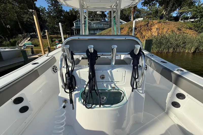 Slide: The Image of 2025 Cape Horn 22 OS boat interior with fishing rod holders and ropes. - 11