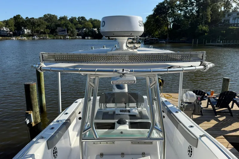 Slide: The Image of 2025 Cape Horn 22 OS boat docked by a scenic waterfront. - 7