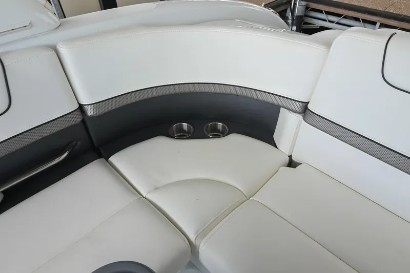 Slide: The Image of 2014 Formula 350 Sun Sport boat interior with white cushioned seating and cup holders. - 24