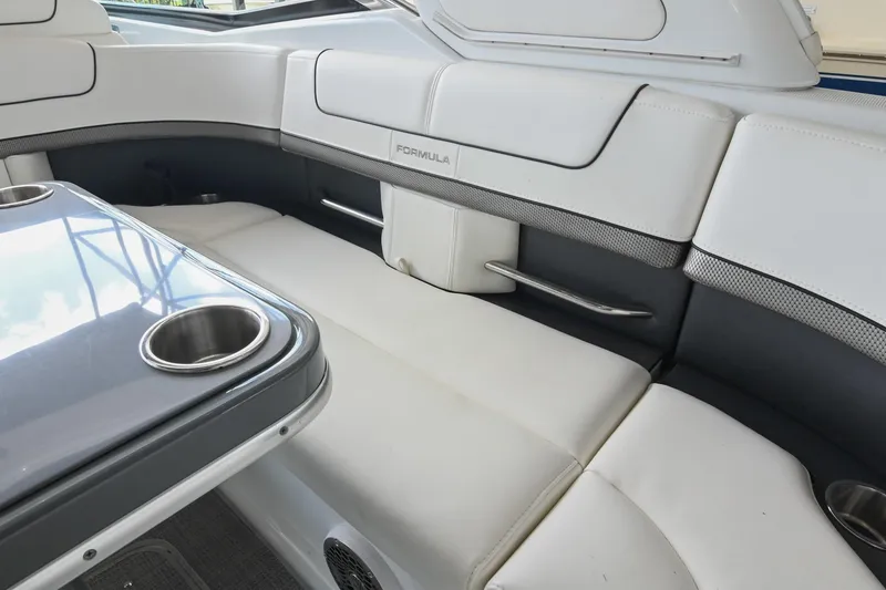 Slide: The Image of 2014 Formula 350 Sun Sport boat interior with white seating and table. - 25