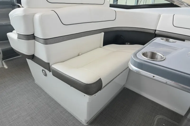 Slide: The Image of 2014 Formula 350 Sun Sport interior with white seating and cupholders. - 26