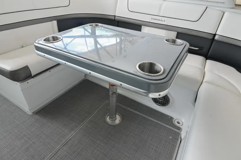 Slide: The Image of 2014 Formula 350 Sun Sport boat interior with table and seating area. - 27
